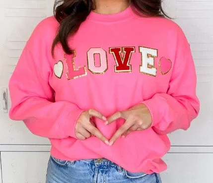 Weekend Discounts to Indulge In LOVE Patch Pink Sweatshirt